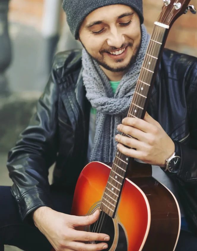 webdesign Hamburg Northbay young-musician-with-guitar-in-city webdesign Hamburg Northbay young-musician-with-guitar-in-city